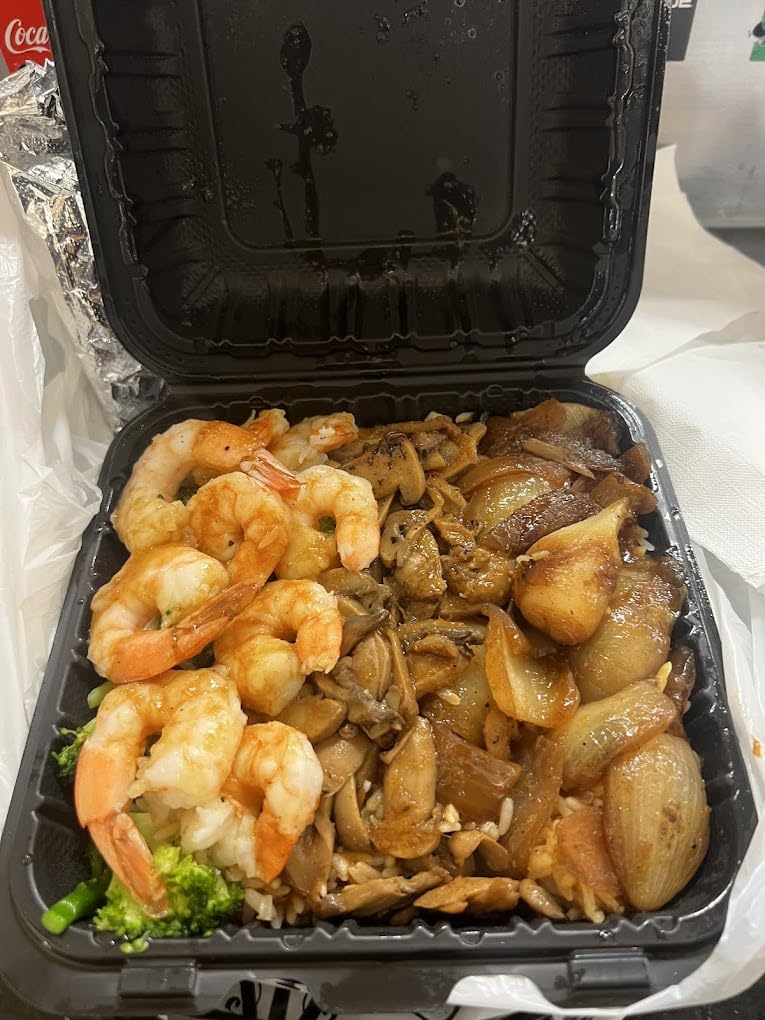 Takeout meal with shrimp, vegetables and potatoes