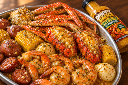 Serving suggestion: garlic butter lobster tails with snow crab, shrimp and seafood boil sides